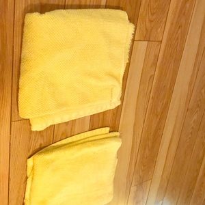 Two yellow bathroom towels